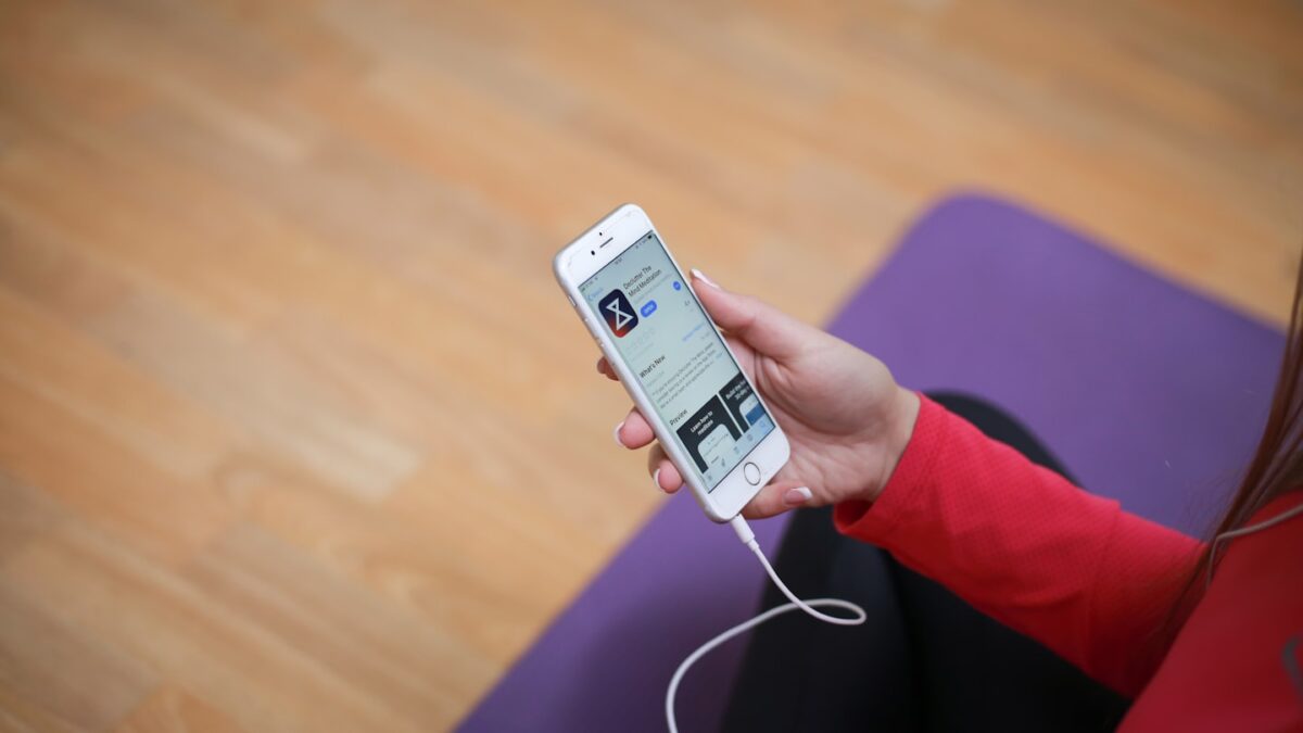 Fitness coach on a video call with a client, showing how online personal training builds client trust and loyalty