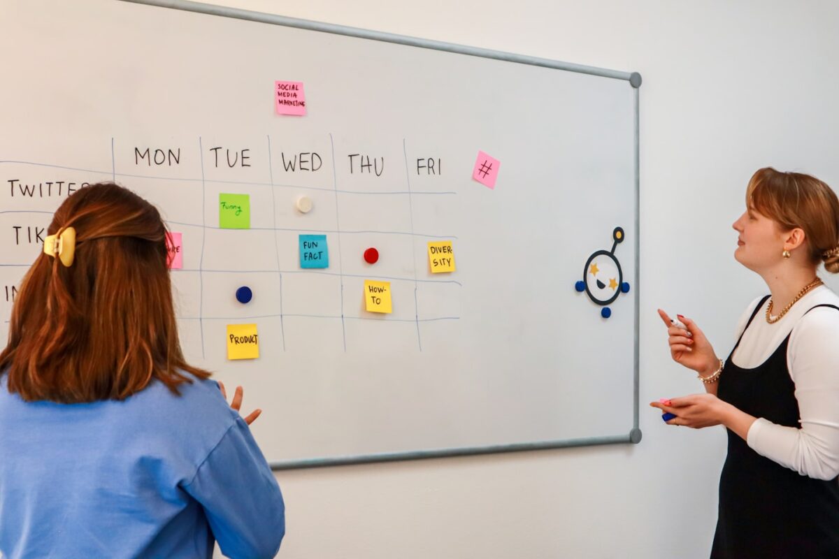 Church organizer reviewing a funeral planning board for an online memorial service