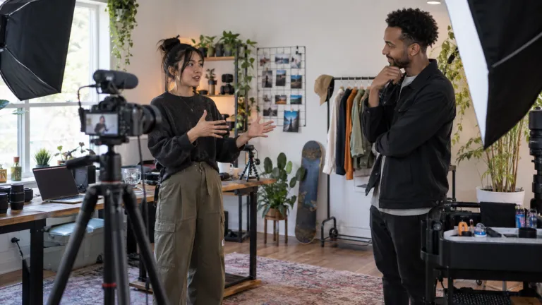 Creator and platform founder discussing work in a filming studio
