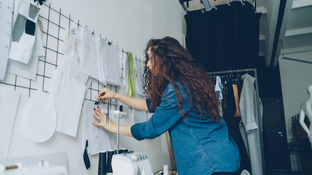 A fashion designer working on a mood board