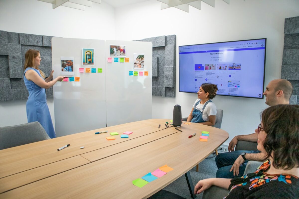 a group of people sitting around a conference table
