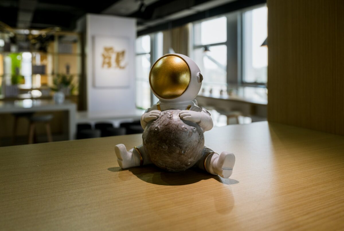 a small toy sitting on top of a wooden table